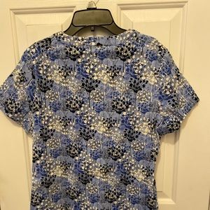 Small blue scrub top with black and white flowers